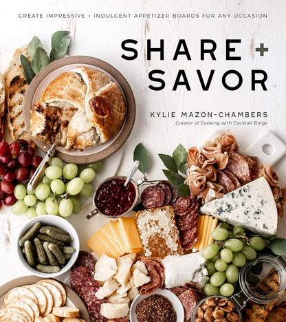 Book cover of 'Share + Savor' by Kylie Mazon-Chambers featuring a charcuterie board with various food items.