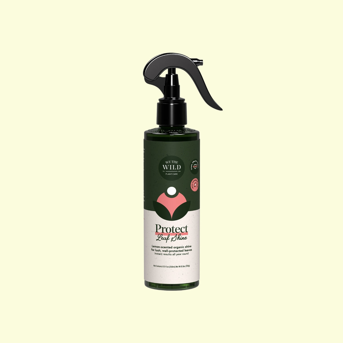 A bottle of Wild Harvest Protect Leaf Choke spray with a black trigger sprayer and a dark green and white label, centered on a pale yellow background.