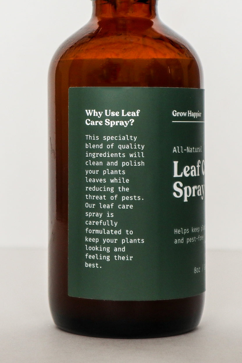 Brown bottle of 'Leaf Care Spray' with a green label on a white background
