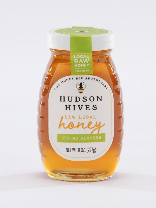 Jar of Hudson Hives honey with a green label on a white background