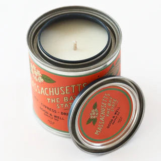 Massachusetts themed candle with orange label on white background
