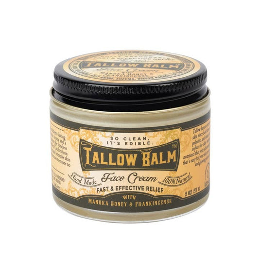 Tallow balm in a small jar with a black lid, on a white background