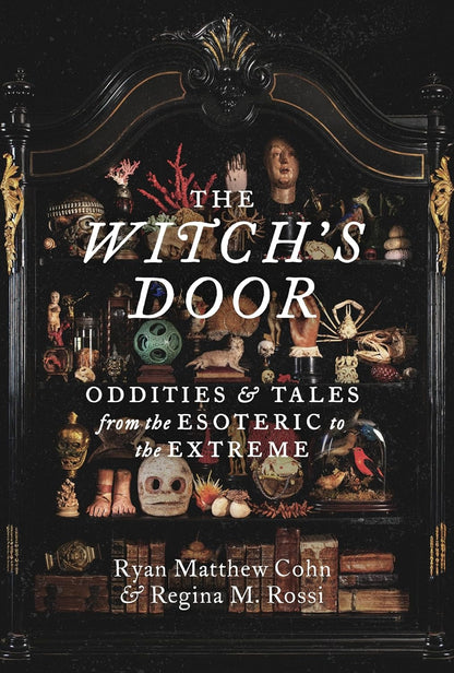 Book cover of 'The Witch's Door' with a dark background and various objects.