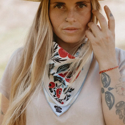Woman wearing a floral scarf with a blurred background