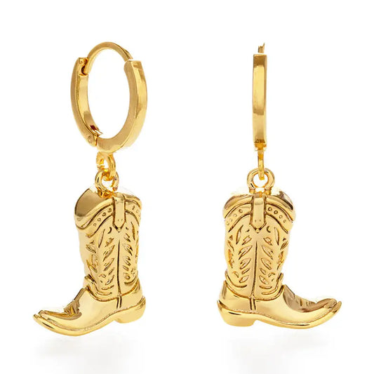 Gold cowboy boot earrings on a white background