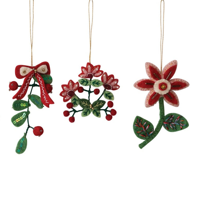 3 decorative hanging ornaments shaped like winter botanical designs