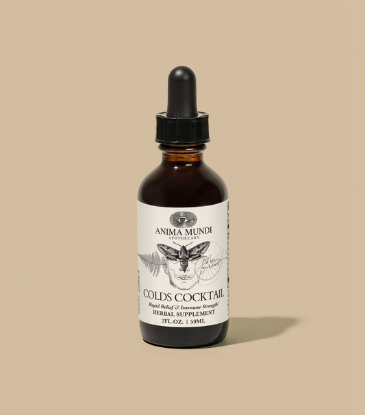 Bottle of Anima Mundi Colds Cocktail on a beige background