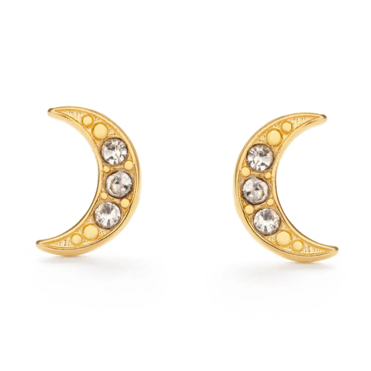 A pair of gold crescent moon stud earrings, each adorned with three clear round-cut crystals and small gold dots along the curve, set against a plain white background.
