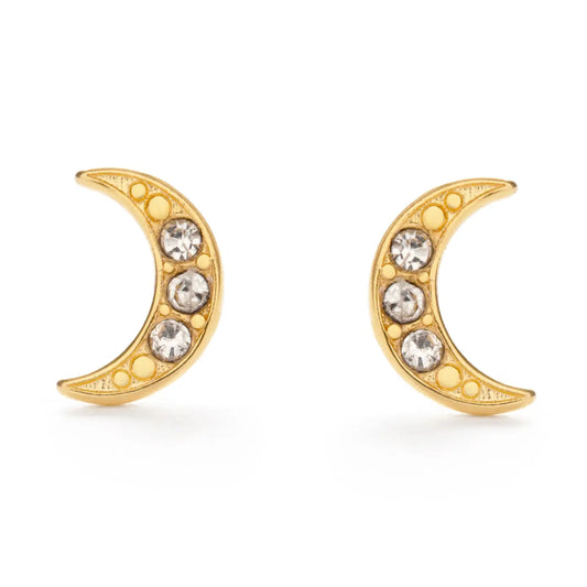 A pair of gold crescent moon stud earrings, each adorned with three clear round-cut crystals and small gold dots along the curve, set against a plain white background.