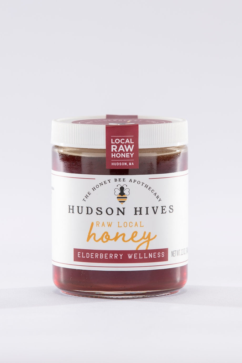 Jar of Hudson Hives raw local honey on a white background