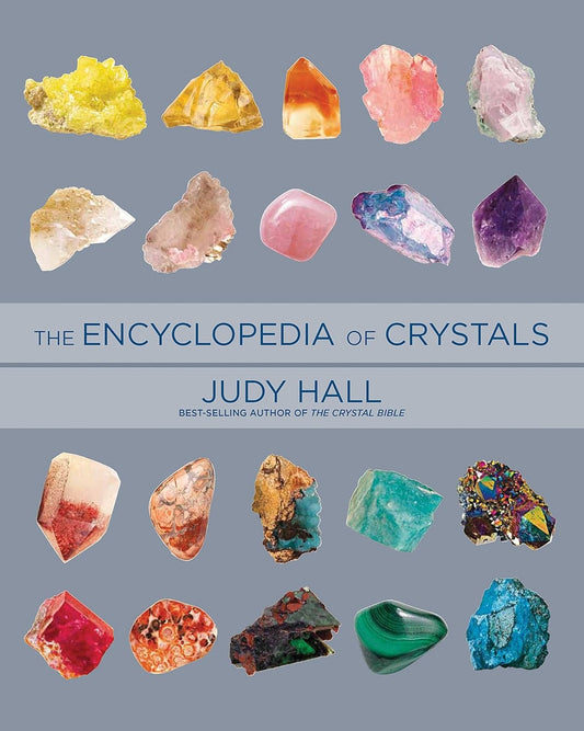 Cover of 'The Encyclopedia of Crystals' by Judy Hall with images of various crystals on a gray background.