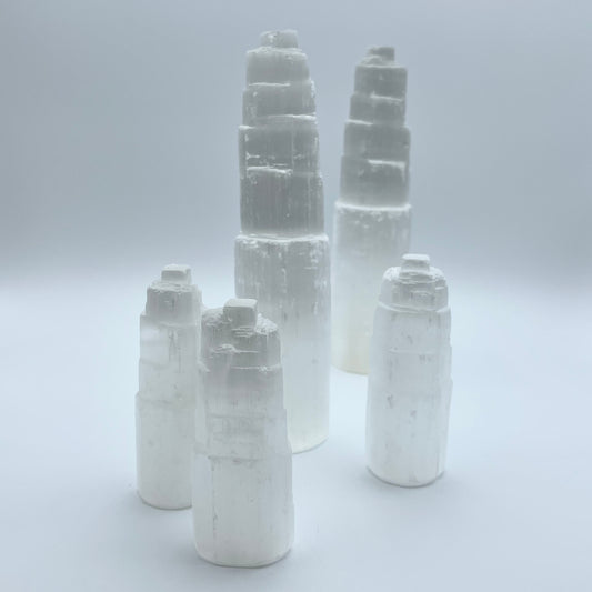 5 selenite towers on grey background