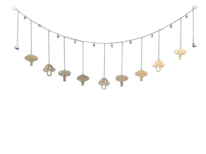 A decorative garland with gold mushrooms and gold beads