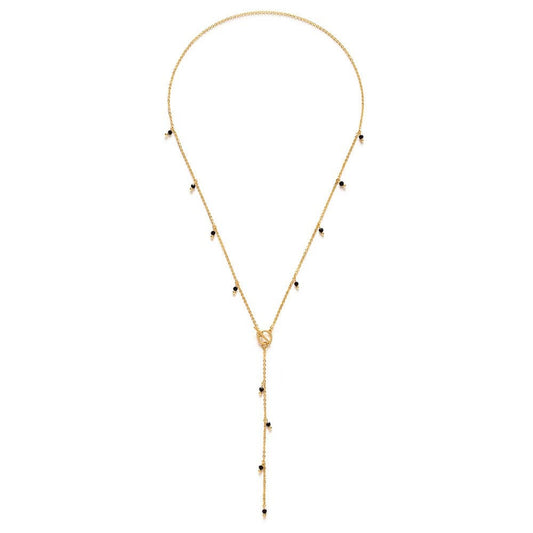 Gold necklace with black Japanese glass beads on a white background