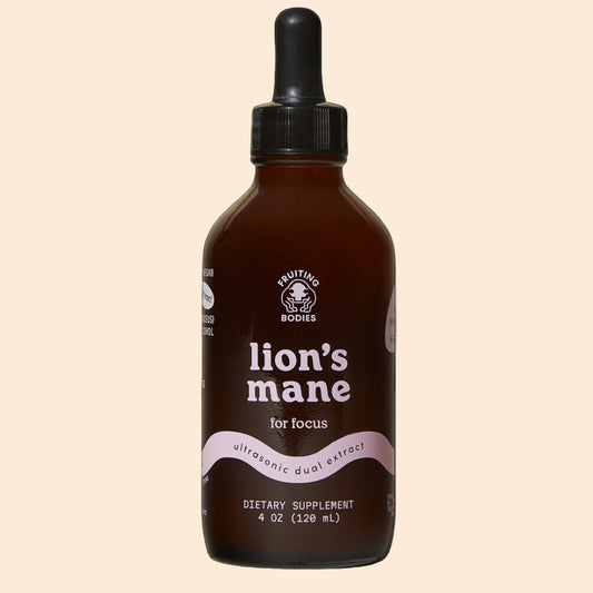 Bottle of 'lion's mane' dietary supplement with a black background