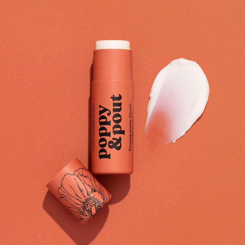 Poppy & Pout lip balm on an orange background