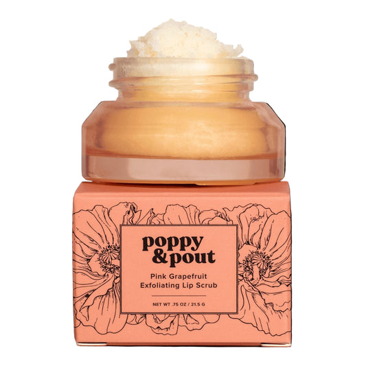 Pink grapefruit exfoliating lip scrub jar with floral design and 'Poppy & Pout' branding on a black background.