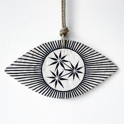 Ceramic eye shaped wall hanger with black and white design