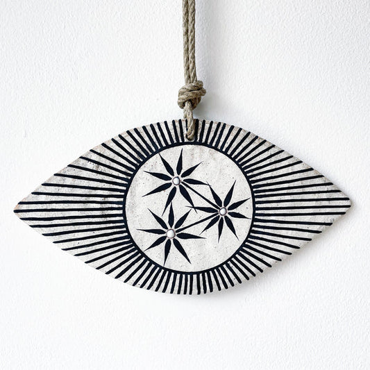 Ceramic eye shaped wall hanger with black and white design