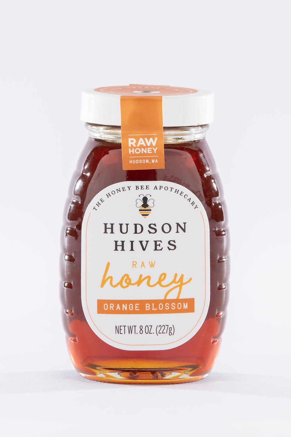 Bottle of Hudson Hives raw honey on a white background