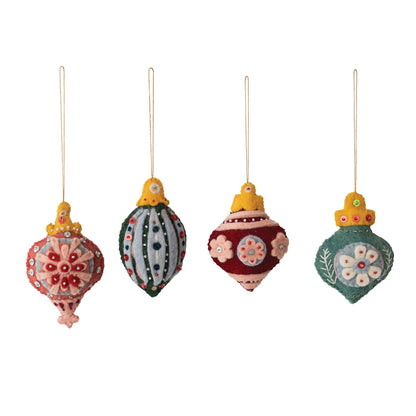 Set of four colorful Christmas ornaments on a white background