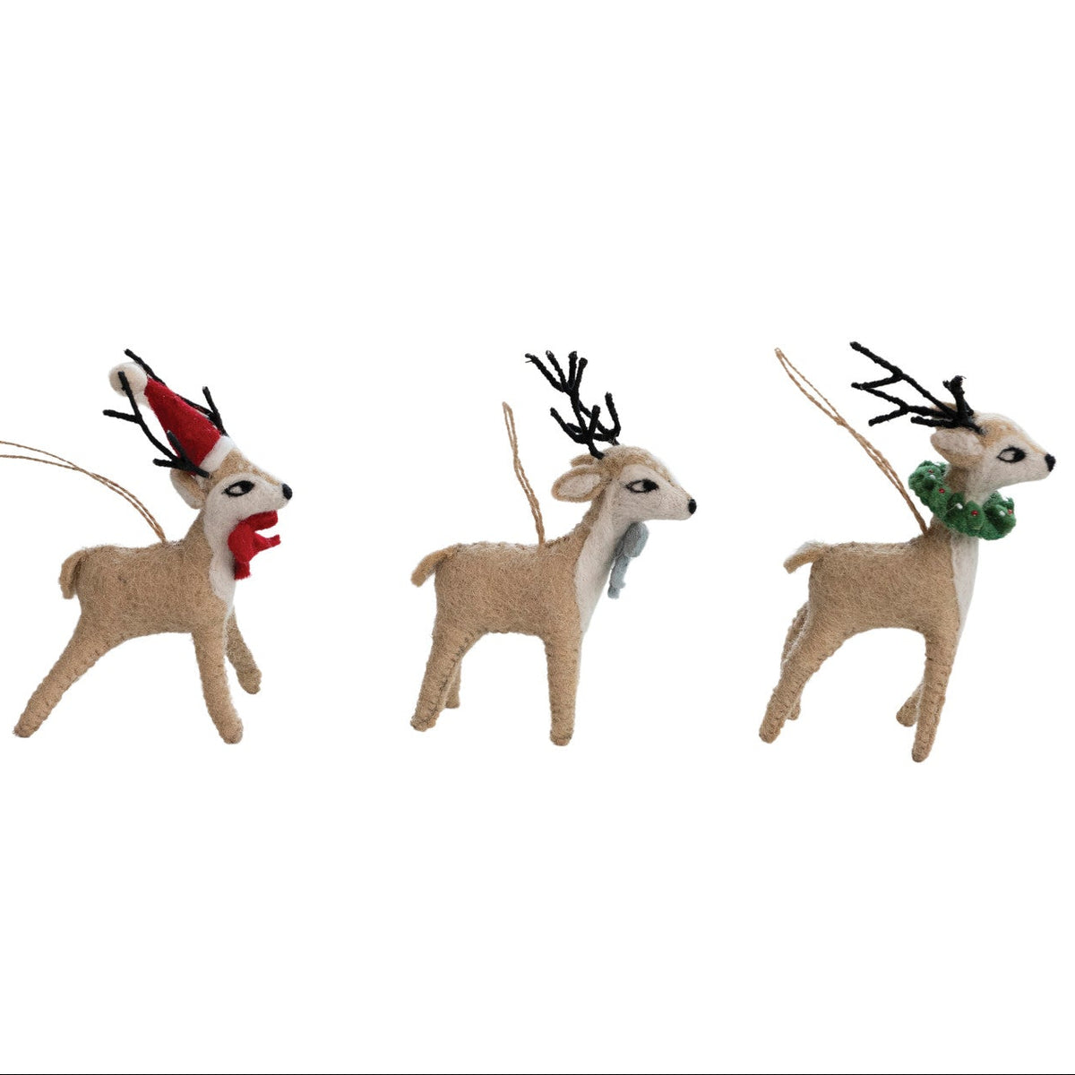 Three decorative deer ornaments with various accessories on a white background