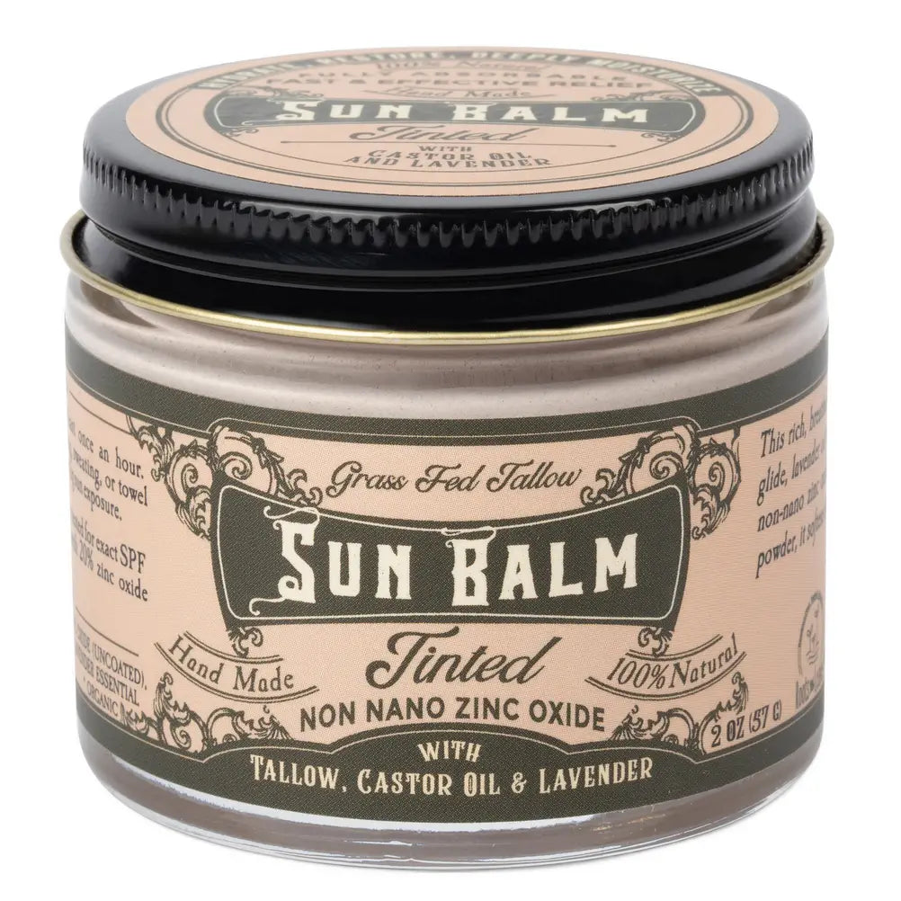 A jar of Sun Balm Tinted Grass Fed Tallow SPF 30 sunscreen balm, featuring a beige label with black text and a black lid, on a white background.