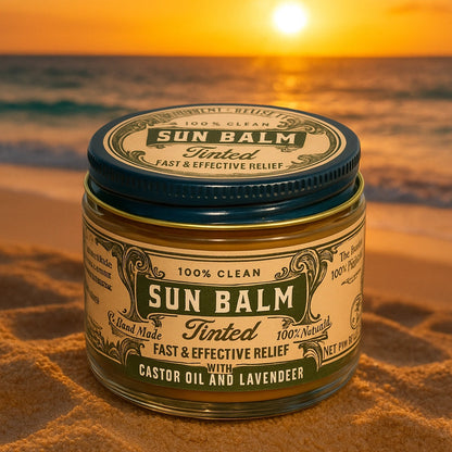 Jar of Sun Balm on sand with sunset over ocean