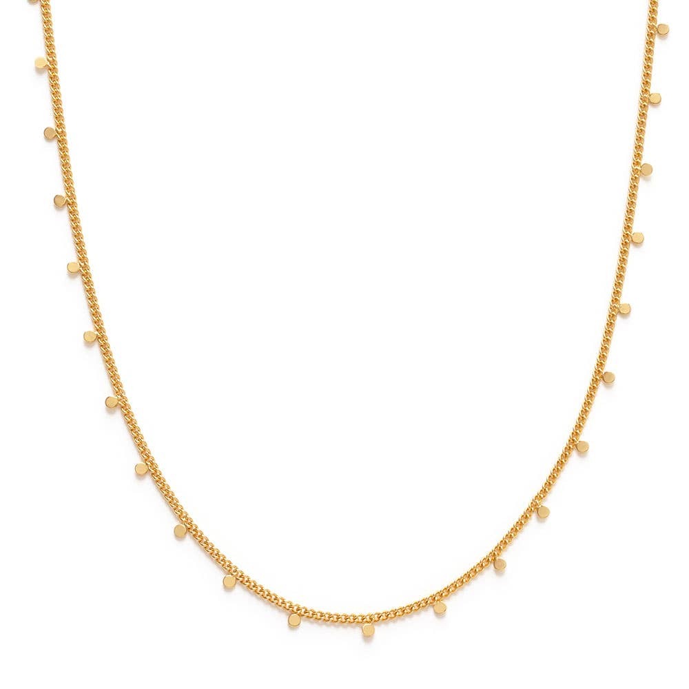 Gold necklace with small flat gold charms on a white background
